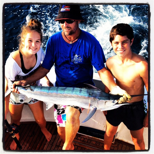 Leigh O'Brien shows off the baby black marlin