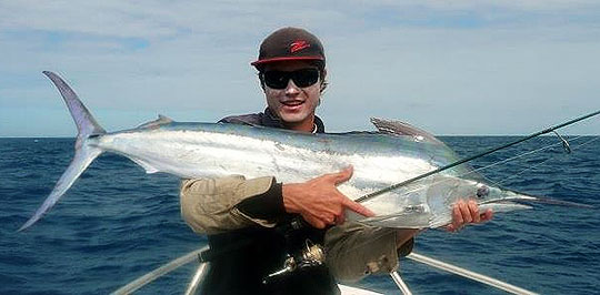 Ethan Farrell with a black marlin at Bowling Green